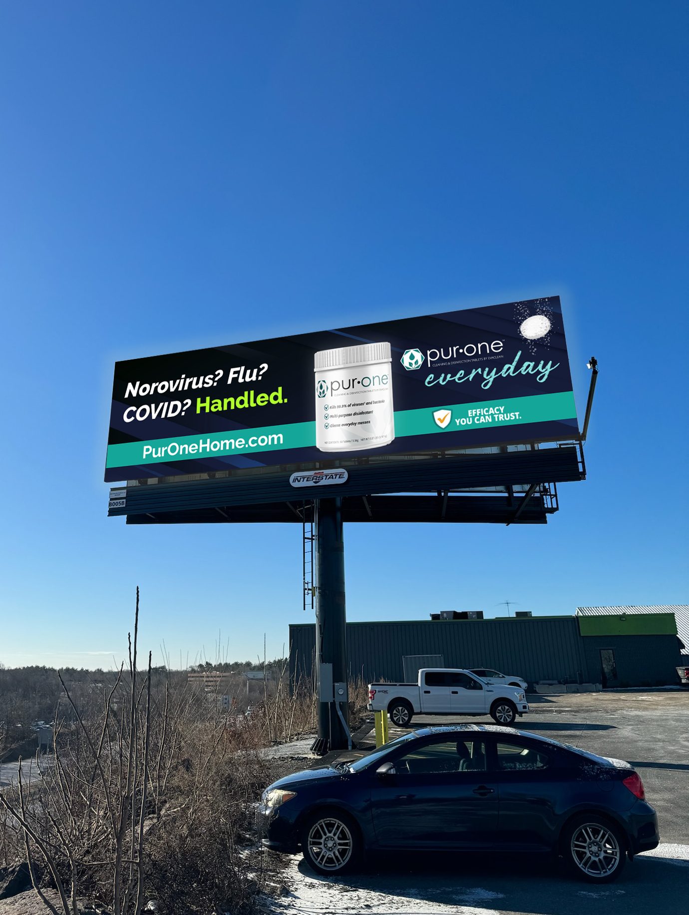 PurOne Everyday billboard — 'Norovirus? Flu? COVID? Handled.' — live out-of-home placement